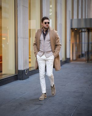 Camel Wool Overcoat with Cream Cable-Knit Vest and White Trousers
