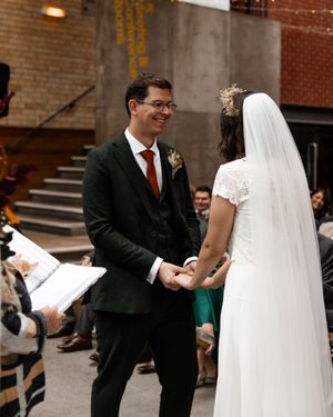 Charcoal Three-Piece Suit with White Shirt and Textured Orange Tie