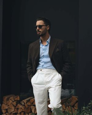 Dark Brown Blazer with Blue Shirt and White Pleated Trousers