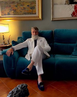 Ivory Double-Breasted Suit with Navy Tie and Velvet Loafers