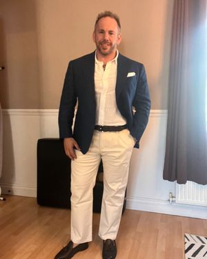 Navy Blazer with White Linen Shirt and Cream Trousers