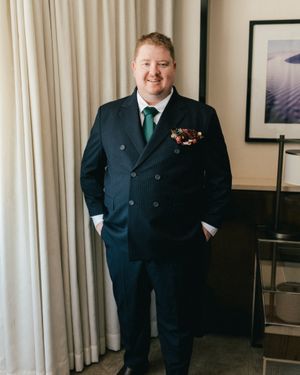 Navy Pinstripe Double-Breasted Suit with White Shirt and Green Tie