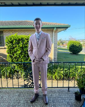 soft-pink-three-piece-suit-brown-chelsea-boots