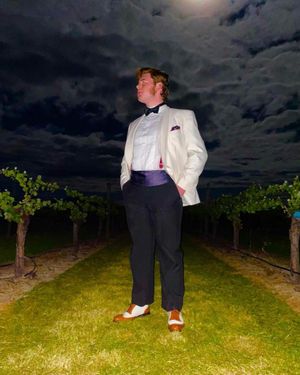 White Dinner Jacket with Black Trousers and Two-Tone Oxford Shoes